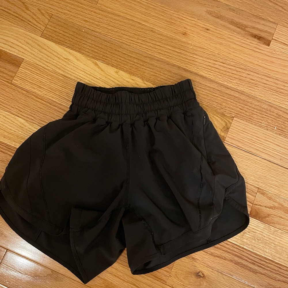 Size 2 4 inch lululemon athletic shorts in color black